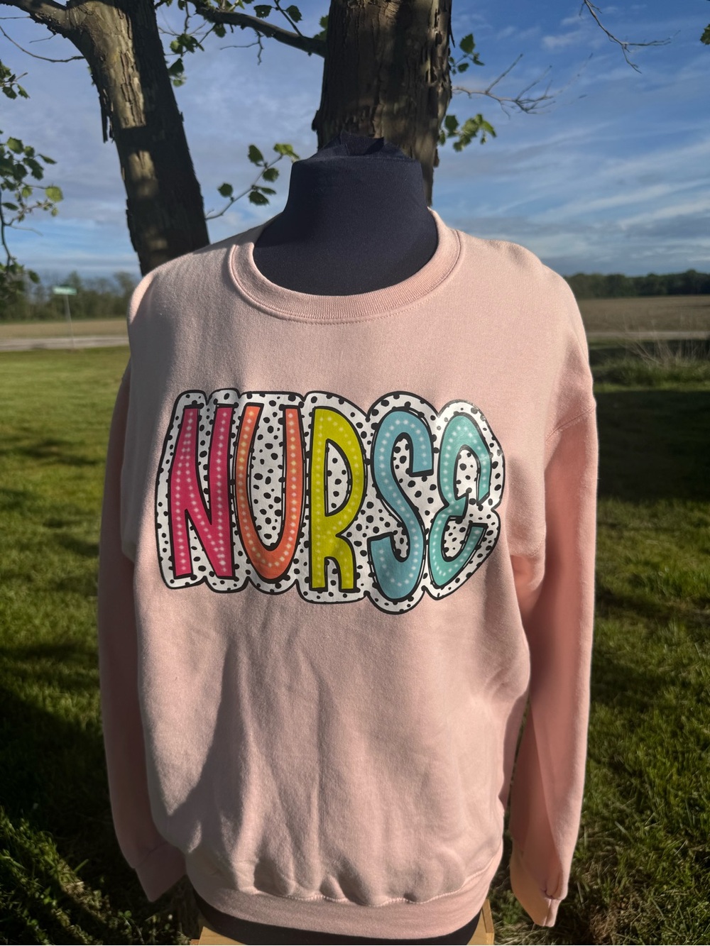 Gildan Pink Crewneck Sweatshirt with Colorful 'NURSE' Graphic